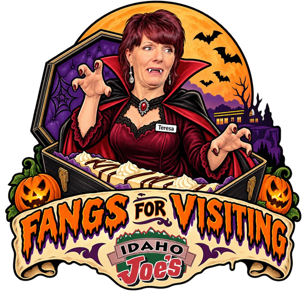 Idaho Joe's sticker: Teresa as a vampire rising from a coffin of cheesecake – “Fangs for Visiting”